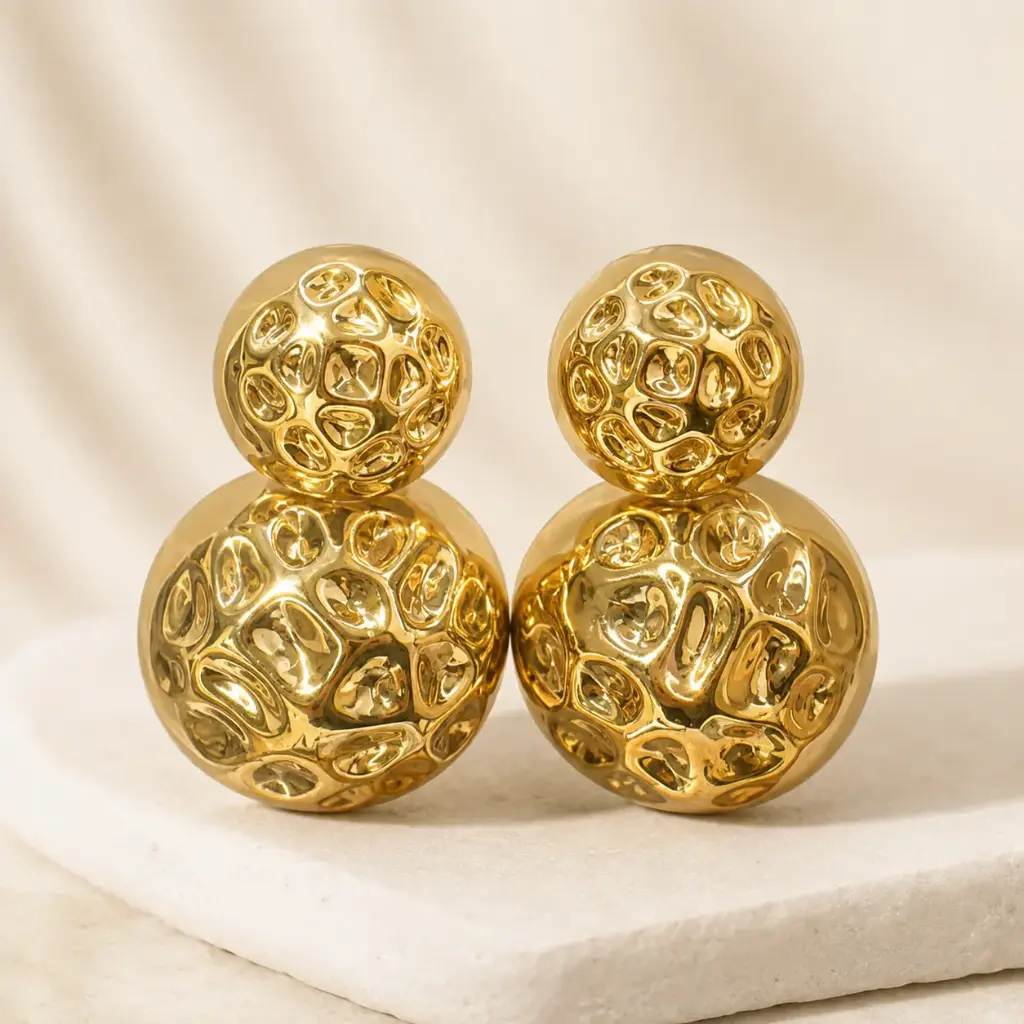 Aretes dorados doble esfera
